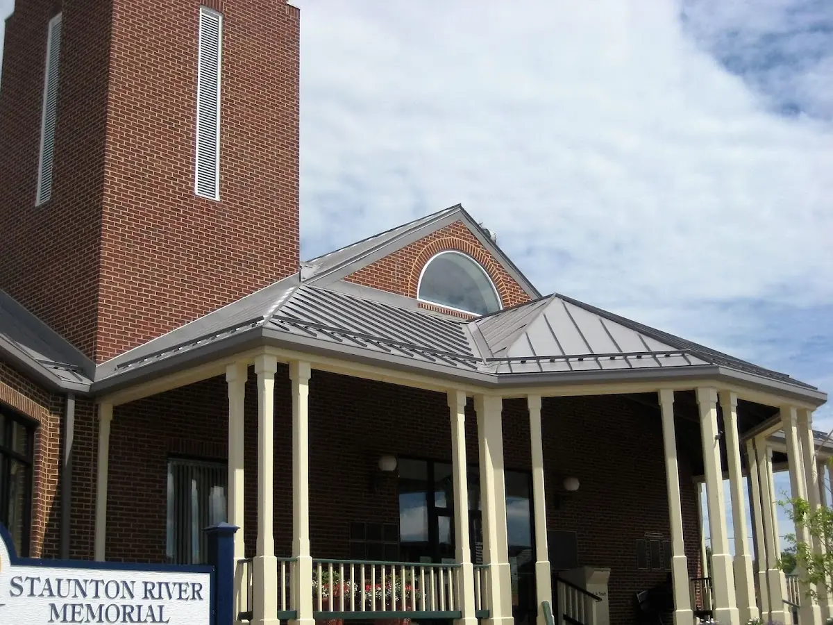 Skilled roofing craftsmen working on a residential roof in Great Lakes